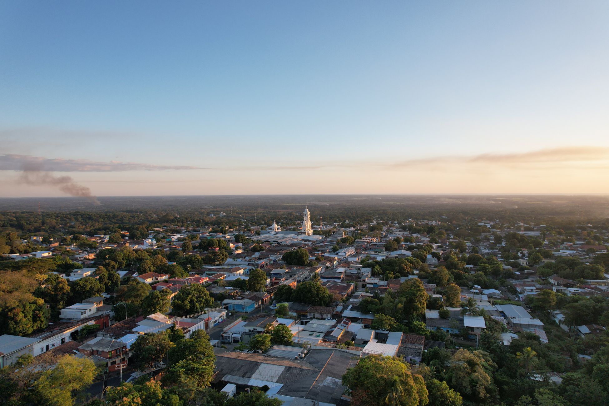 Central park and parish church in the hillside town of La Paz, Honduras, with the Comayagua valley behind